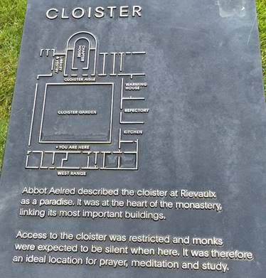 A sign on the grass
Description automatically generated